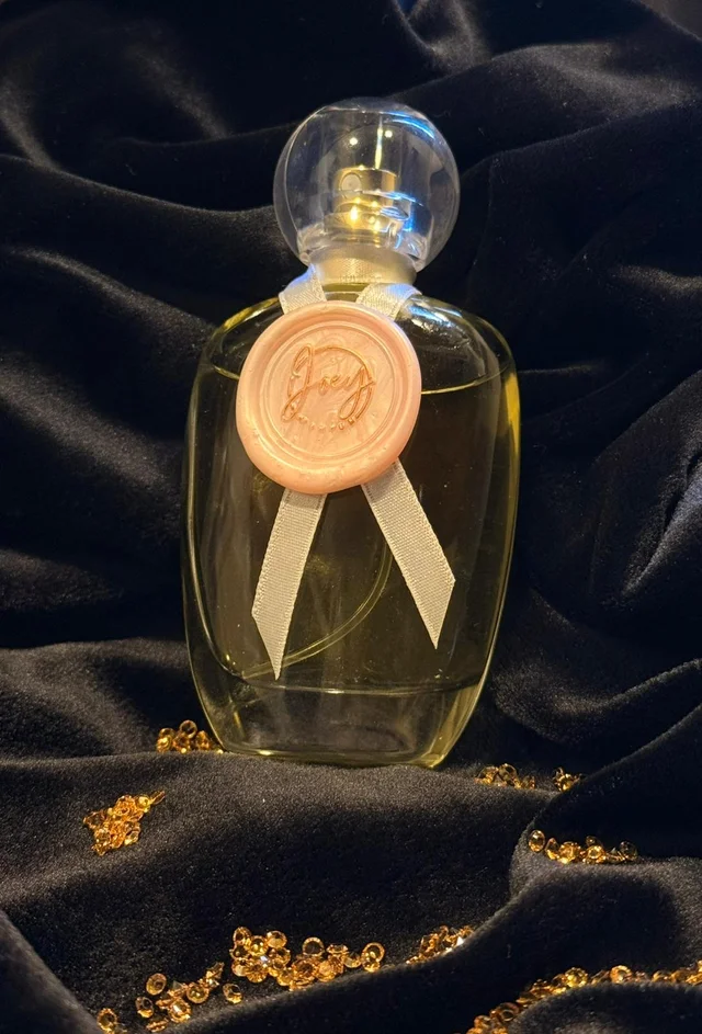 Joey — perfume bottle with wax seal on black velvet